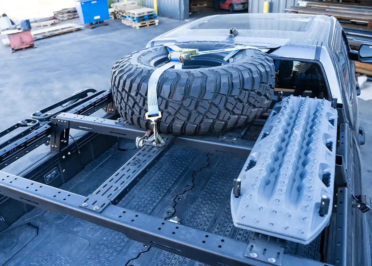 Image detailing the Backwoods Adventure Mods Toyota Tundra Mid Height Bed Rack modular mounting system for truck bed cargo storage