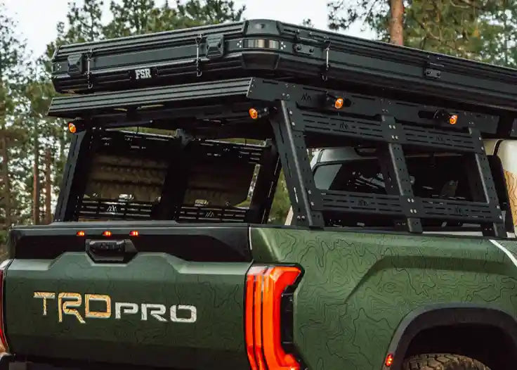 Backwoods Adventure Mods Truck Bed Rack System Starter Bundle installed on a 3rd Gen Toyota Tundra with a roof top tent mounted on top