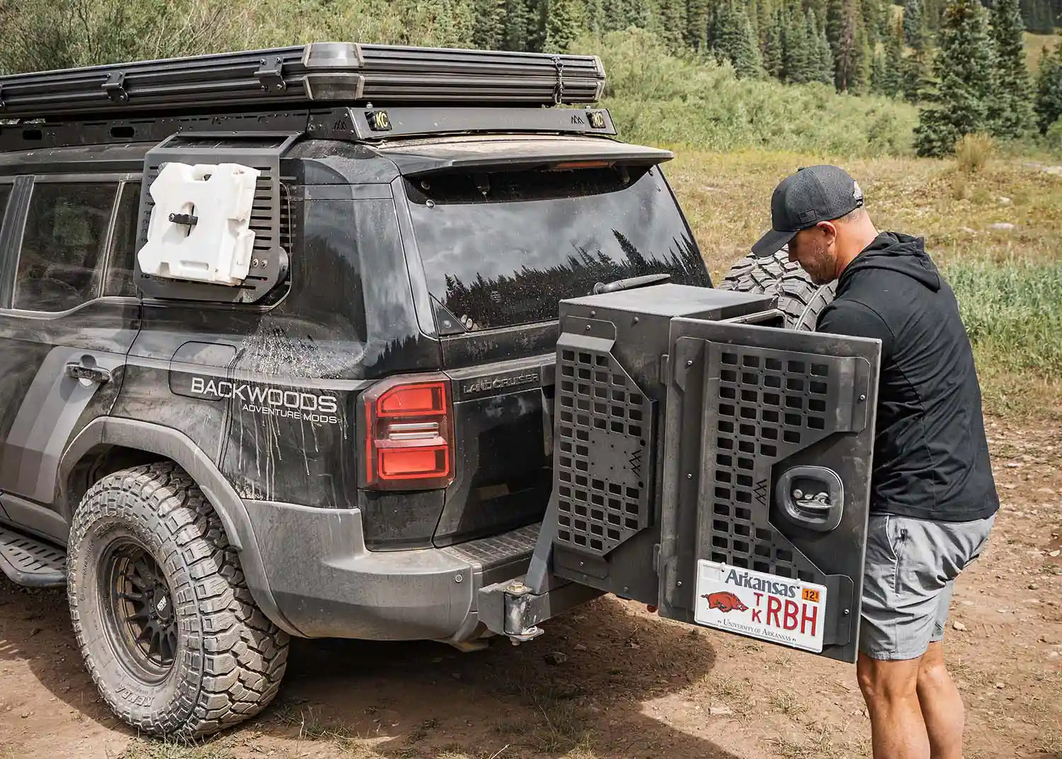 Toyota Landcruiser with the Backwoods Adventure Mods Universal off-road vehicle overland storage cargo box open while camping 