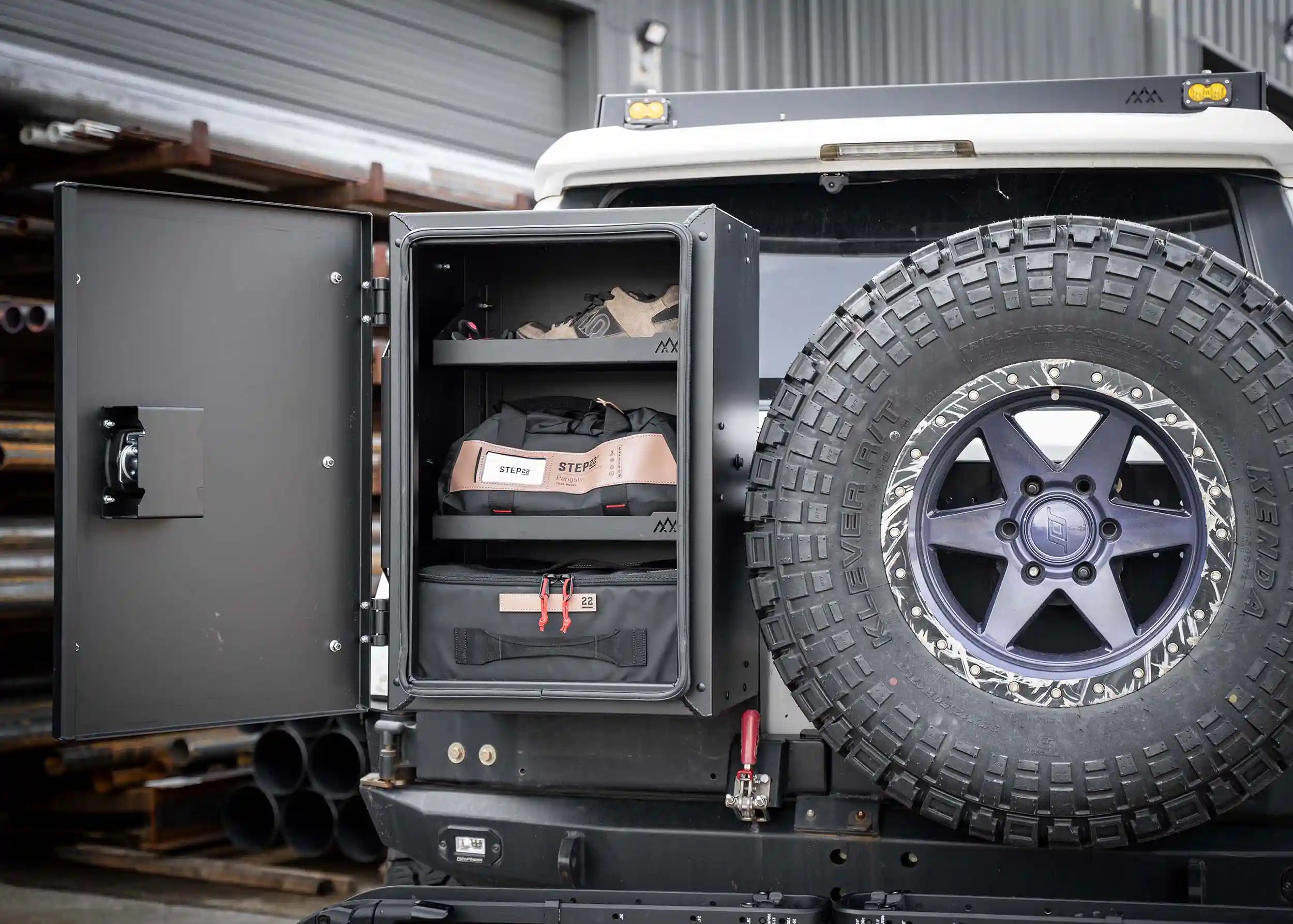 Backwoods Adventure Mods Universal off-road vehicle overland storage cargo box open showing gear organized neatly inside