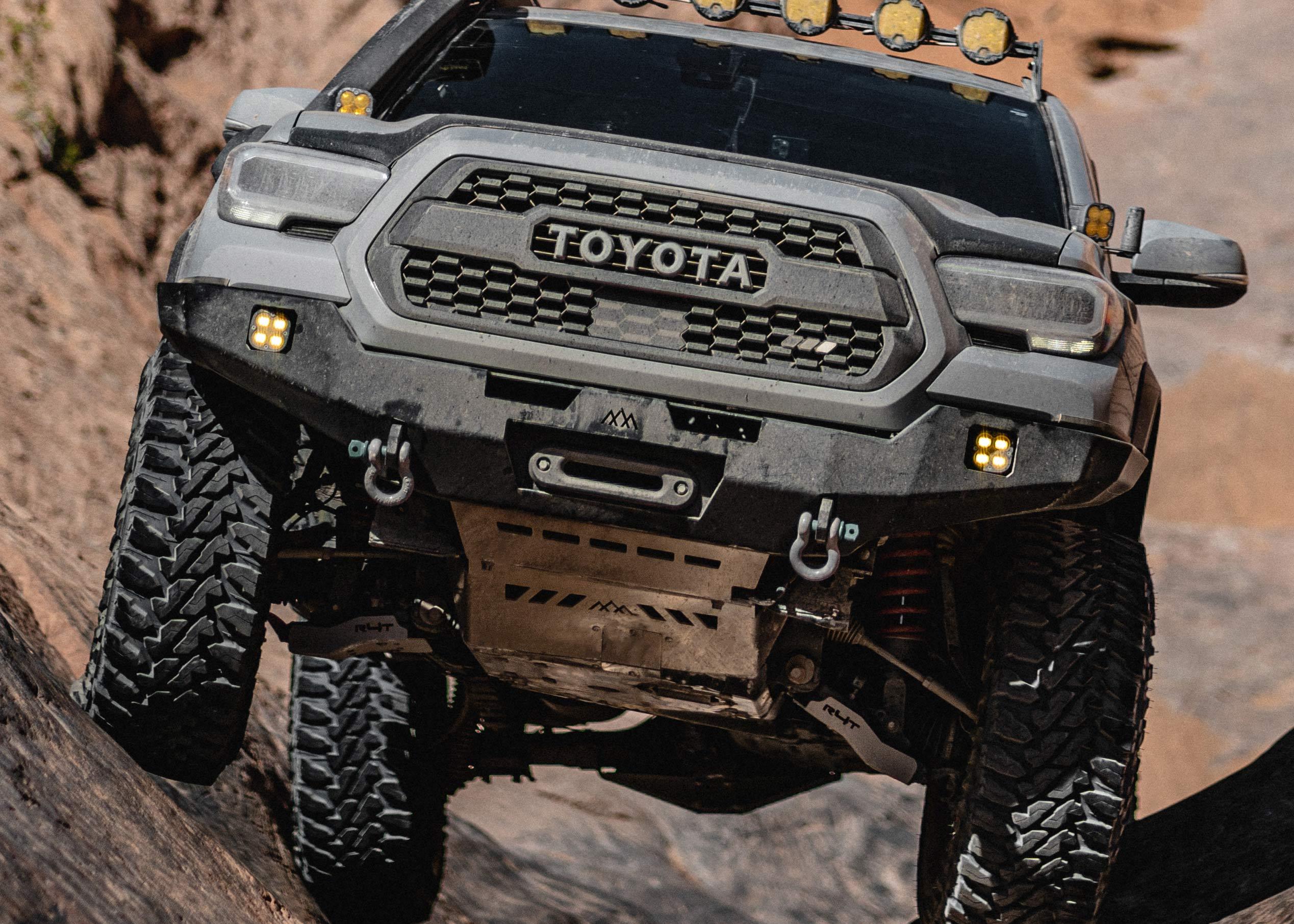 Backwoods Adventure Mods Aluminum Skid Plate Kit for 2nd and 3rd Gen Toyota Tacoma installed and being used while rock crawling off road