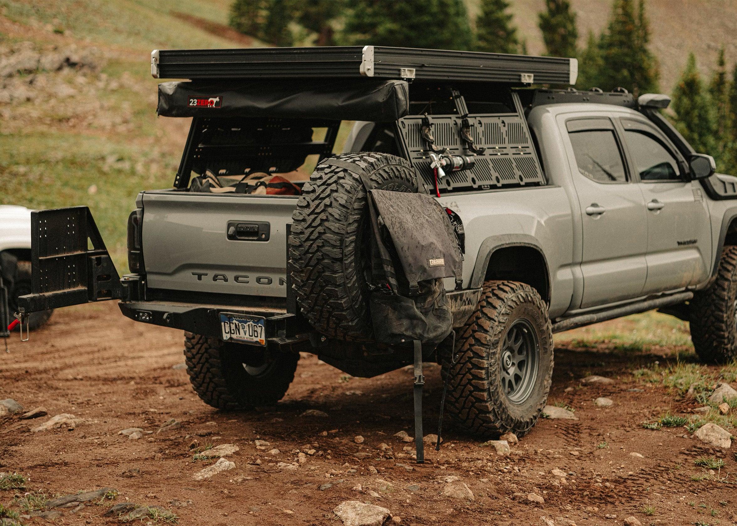 Spare tire carrier mount on the Backwoods Adventure Mods 2016-2023 3rd Gen Toyota Tacoma Hi-Lite High Clearance Dual Swing Out Rear Bumper 