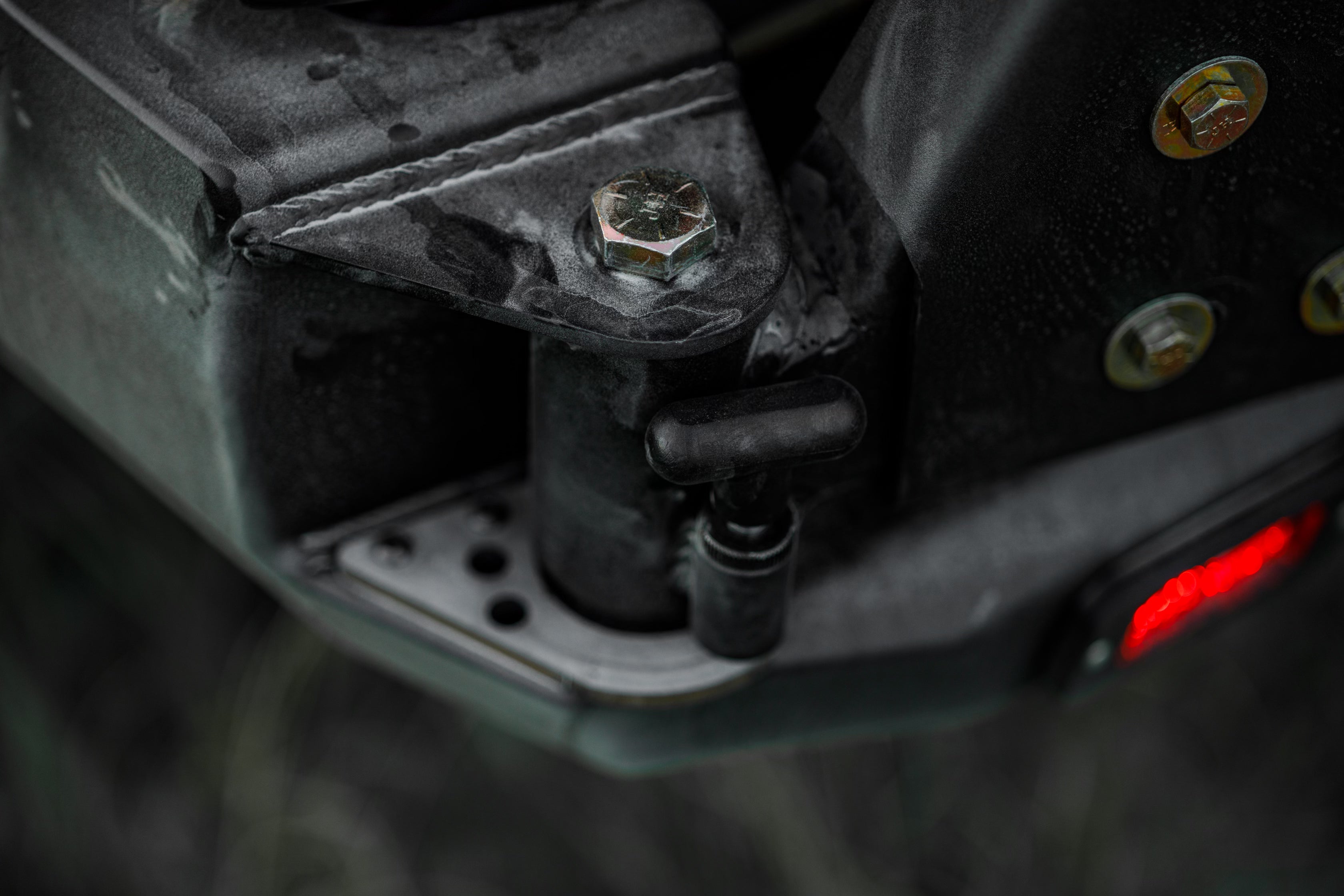 Close up of the swing out hinge on the Backwoods Adventure Mods 2016-2023 3rd Gen Toyota Tacoma Hi-Lite High Clearance Dual Swing Out Rear Bumper 