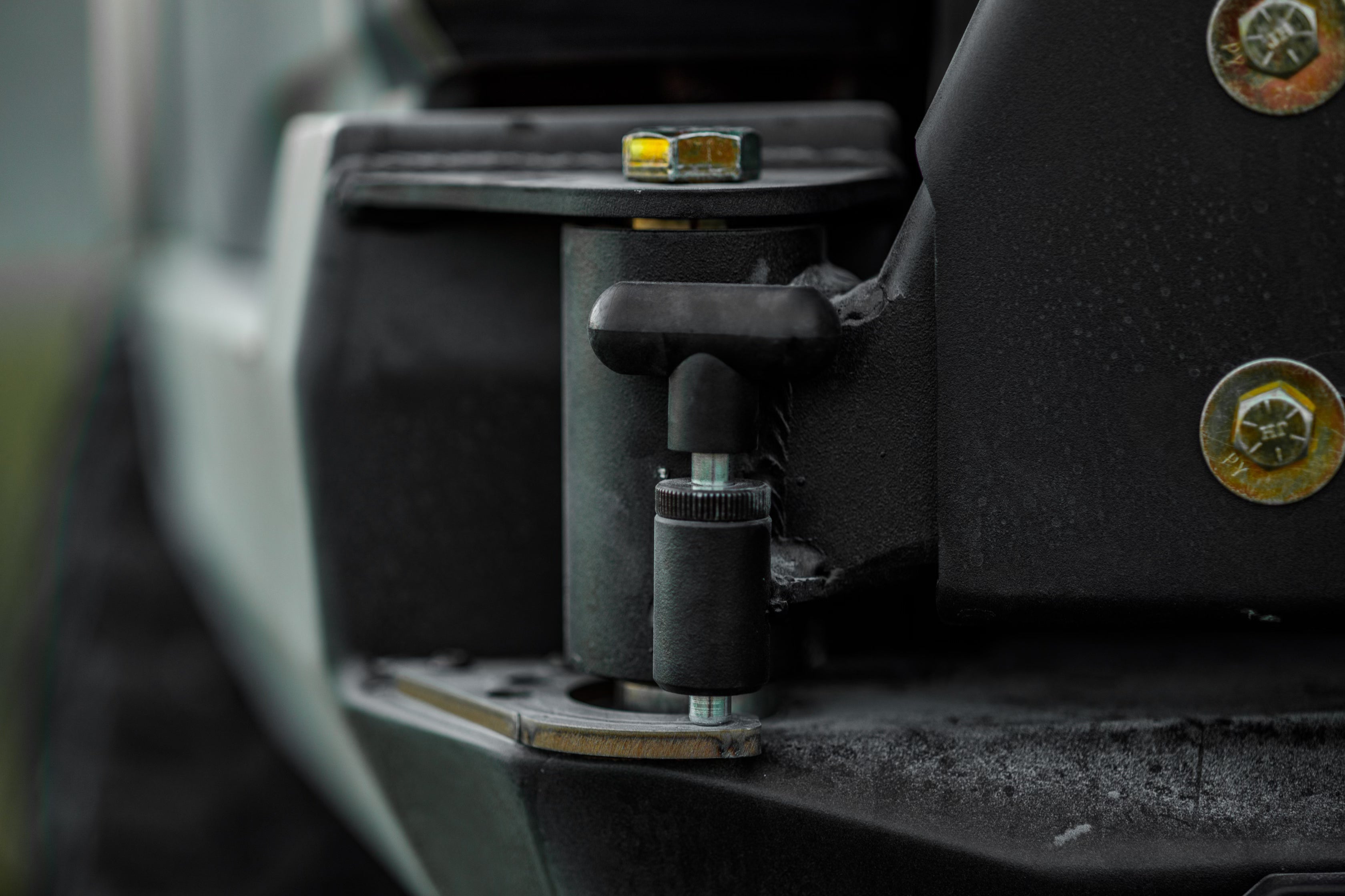Close up of the latch pin on the Backwoods Adventure Mods 2016-2023 3rd Gen Toyota Tacoma Hi-Lite High Clearance Dual Swing Out Rear Bumper 