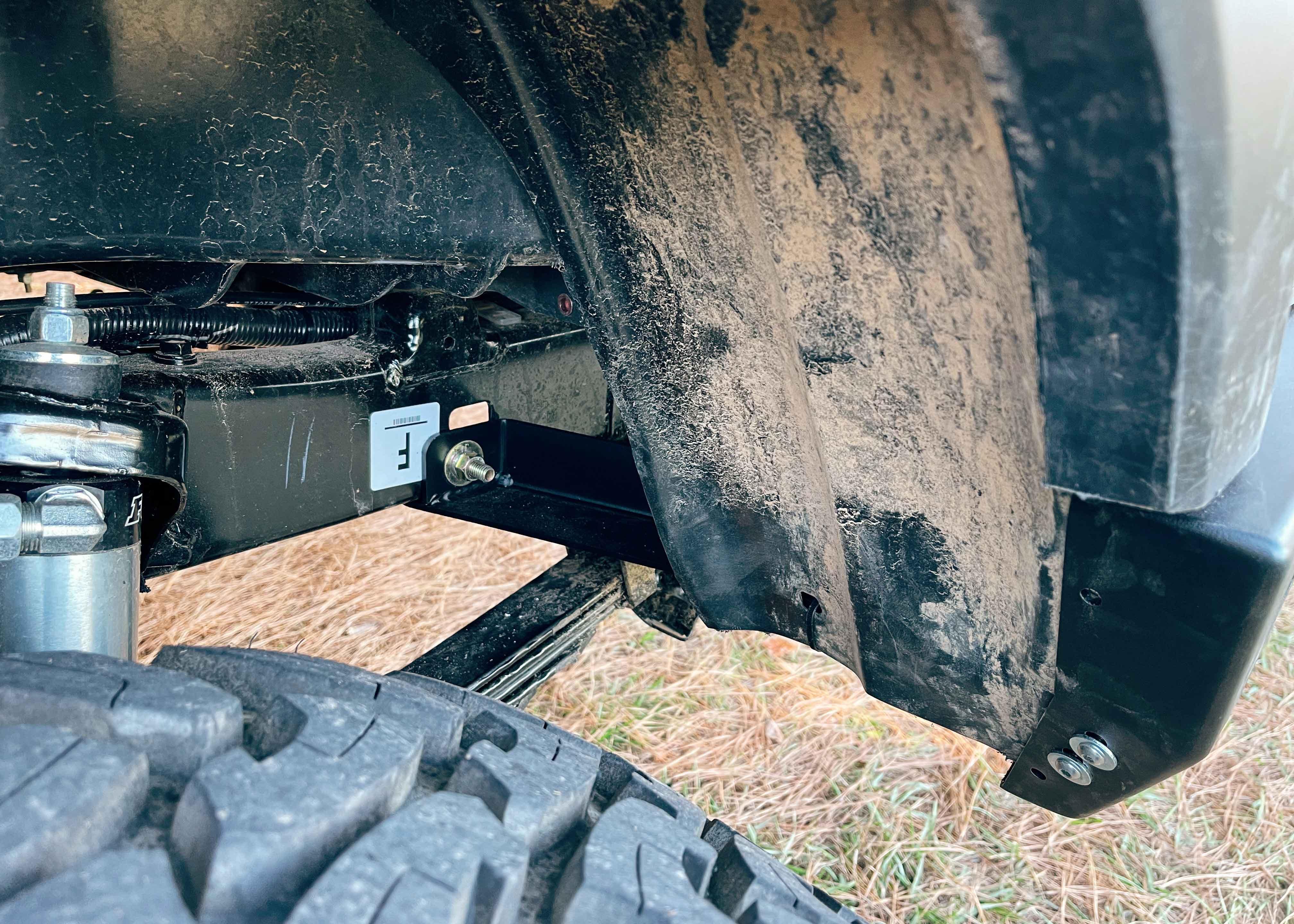 Close up of the wheel-well attachment point on the Backwoods Adventure Mods 2016-2023 3rd Gen Toyota Tacoma Hi-Lite High Clearance Dual Swing Out Rear Bumper 