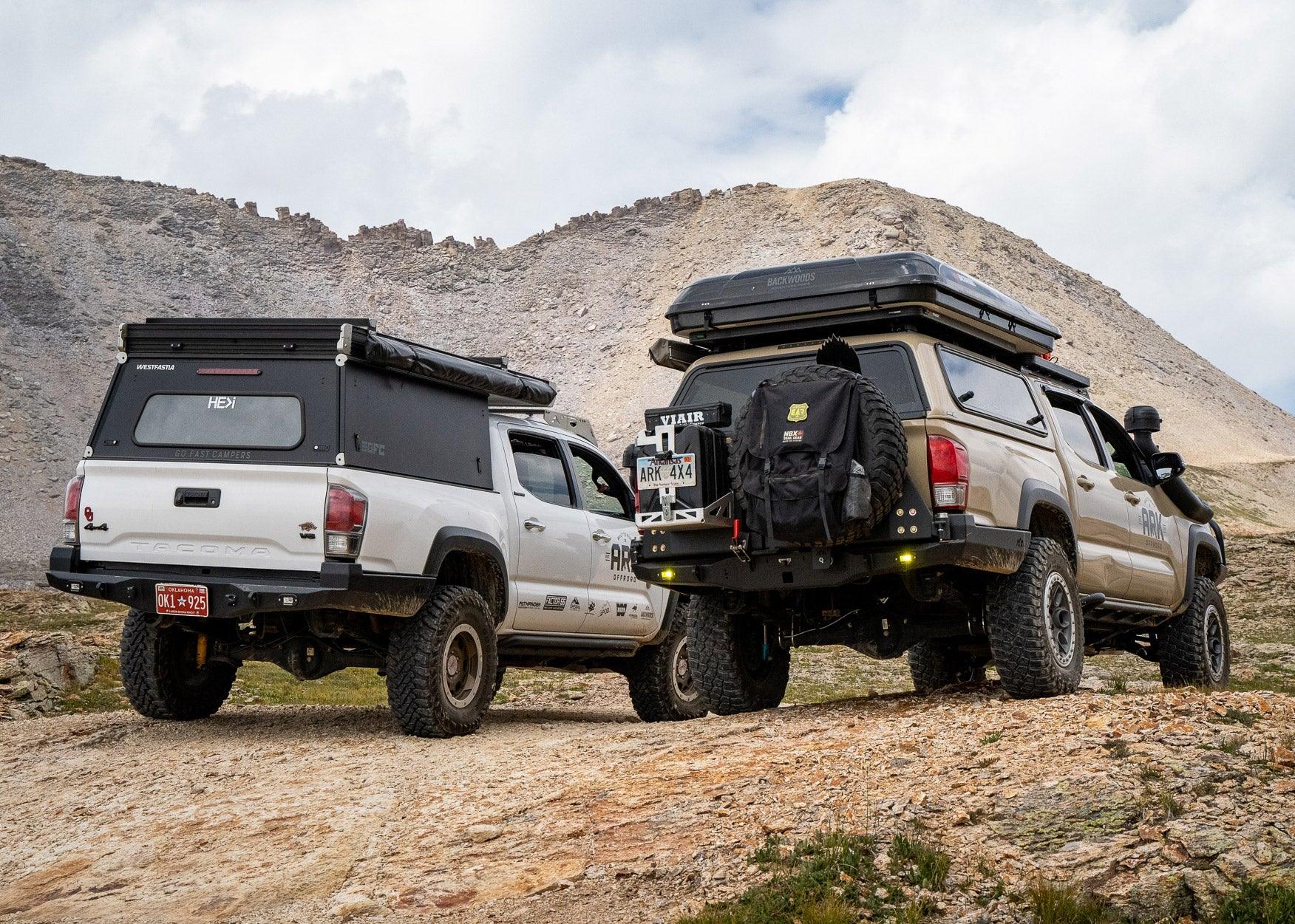 Two 3rd Gen Toyota Tacomas with Hi-Lite High Clearance Rear Bumpers from Backwoods Adventure Mods installed