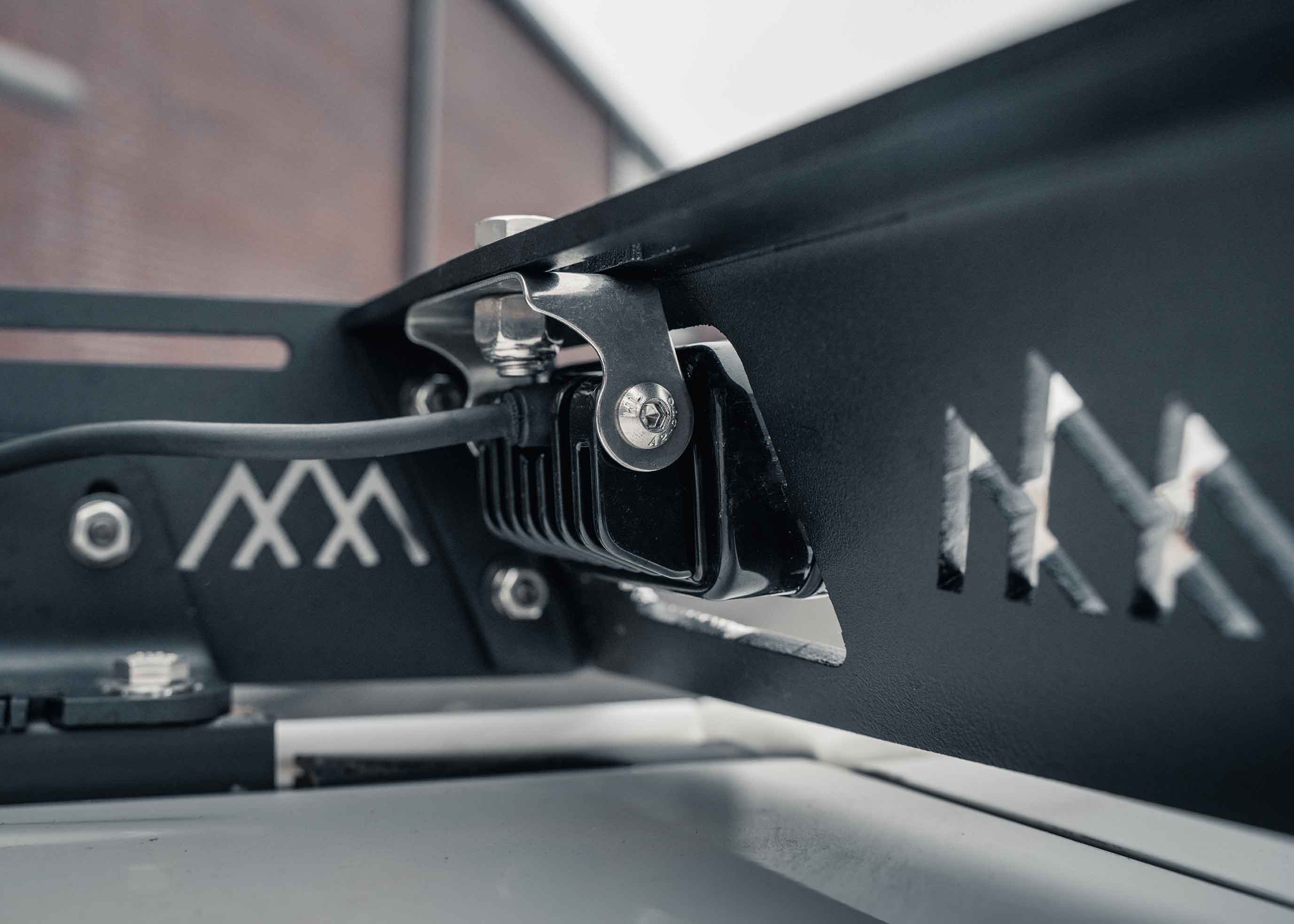 Back of the rear off road chase light mount in the Backwoods Adventure Mods Toyota 2010-2024 5th Gen 4Runner DRIFTR Roof Rack 